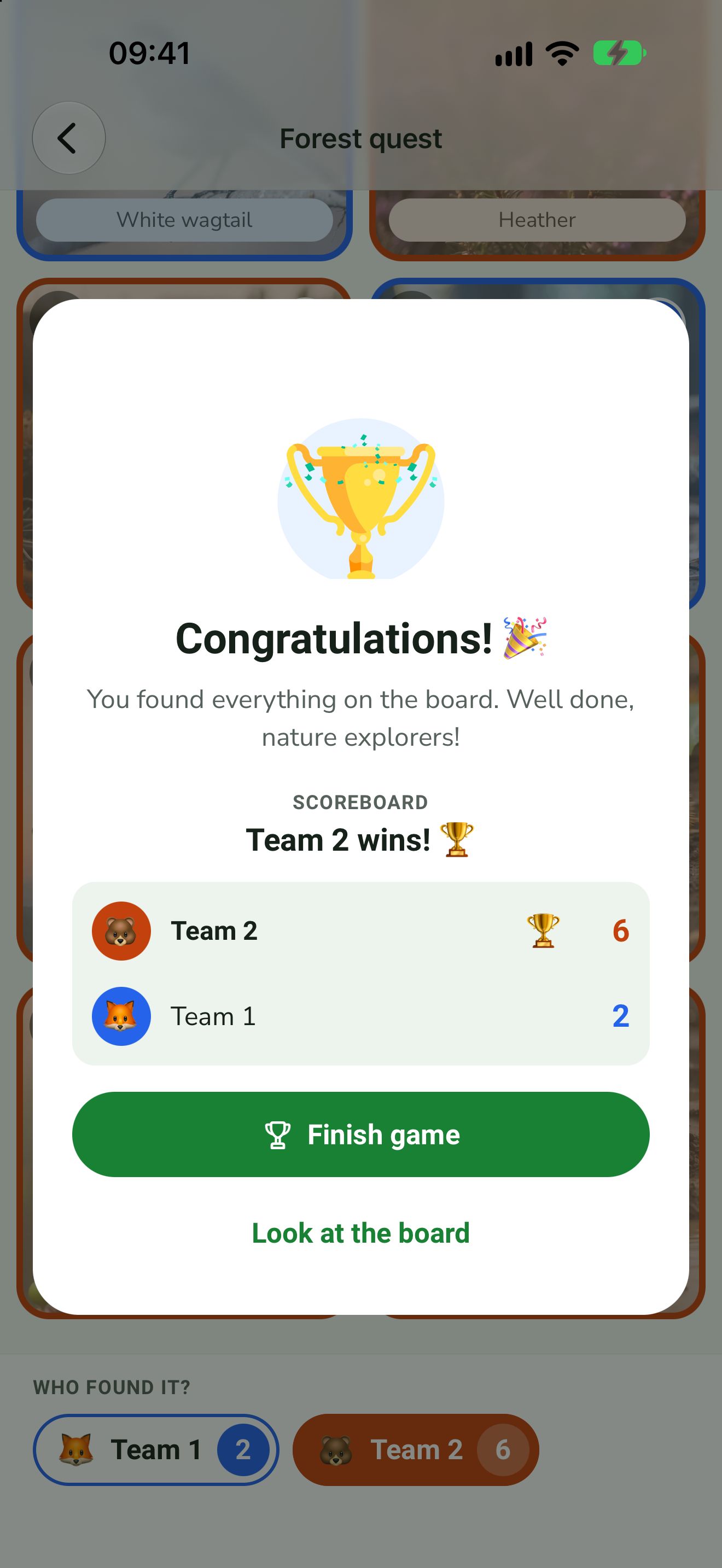 Congratulations screen with trophy and team scoreboard